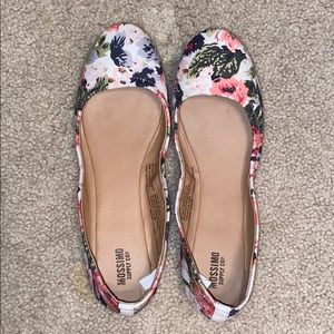 Pair of flowery flat shoes
